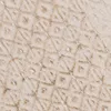 A close-up view of a textured beige carpet with a diamond pattern. Produktbild-Vorschau