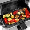 Close-up of an open grill with various vegetables being grilled. Podgląd zdjęcia produktu