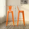 Two orange bar stools with dimensions indicated by dotted lines and measurements. Podgląd zdjęcia produktu