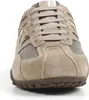 A close-up front view of a beige and gray Geox sneaker. Produktbild-Vorschau