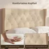 A close-up of a tufted headboard with two pillows, and inset images showing a hand pressing into soft material and a detail of the fabric. Produktbild-Vorschau