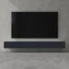 A modern TV stand mounted on a concrete wall, with a flat-screen TV above it. Voir les images du produit