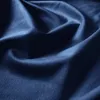 A close-up shot of dark blue fabric, showing its texture and folds. Produktbild-Vorschau