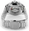 The back of a silver watch with a visible movement and a metal band. Náhled obrázku produktu