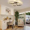 A home office or study area with a desk, chair, built-in cabinets, and a sliding glass door leading to an outdoor patio. Voir les images du produit