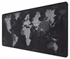 A black and gray world map mousepad is shown from a diagonal angle. Náhled obrázku produktu