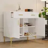 A white sideboard with gold legs and handles, featuring two drawers and two doors that open to reveal shelves with shoes. Produktbild-Vorschau