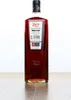 A bottle of Zoco Pacharan liqueur on a wooden surface against a white background. Voir les images du produit