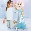 A young girl is playing with a large Elsa doll. Produktbild-Vorschau