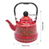A red enamel teapot with decorative patterns, shown with measurement indicators. Voir les images du produit