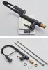 A kitchen faucet with a pull-out spray head is shown on a digital scale, and then disassembled with its components laid out. Produktbild-Vorschau