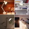 A collage of four images showing a white desk lamp in different settings. Produktbild-Vorschau