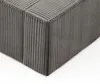 A close-up view of the corner of a gray corduroy upholstered ottoman or bed base. Náhled obrázku produktu