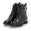 A pair of black, shiny, crocodile-textured lace-up ankle boots with gold accents. Produktbild-Vorschau