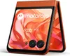 A close-up, angled view of an orange Motorola Razr 50 smartphone, shown in its folded state. Produktbild-Vorschau