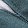 A close-up view of a teal fabric with a zipper. Produktbild-Vorschau
