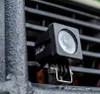 A close-up shot of a black square work light attached to a metal bar. Produktbild-Vorschau