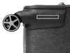 A close-up view of a suitcase wheel and the top corner of the suitcase. Náhled obrázku produktu