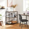 A home office or study area with a bookshelf, desk, and chair. Produktbild-Vorschau