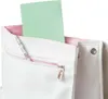 Close-up of the top of a white rucksack with a green notebook and a pencil sticking out of a zippered pocket. Anteprima dell’immagine prodotto
