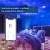 A child sleeping in bed with a star projector illuminating the room. Voir les images du produit