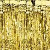 A close-up, full-frame shot of a gold tinsel curtain. Produktbild-Vorschau