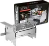 A stainless steel portable grill is shown in front of its packaging. Produktbild-Vorschau