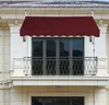 A burgundy awning is installed over a balcony door on a building. Anteprima dell’immagine prodotto