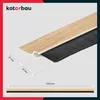 A close-up view of a door seal strip with a wood-like finish and black bristles, showing dimensions. Produktbild-Vorschau