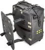 A black adventure pack with a black mounting plate attached to the side, shown against a white background. Produktbild-Vorschau