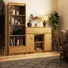 A wooden cabinet and bookshelf filled with decorative items and books in a room setting. Produktbild-Vorschau