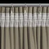 A close-up view of a curtain hanging from a rod. Podgląd zdjęcia produktu