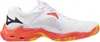 A side view of a white and coral athletic shoe. Produktbild-Vorschau