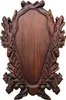 A wooden plaque with oak leaf and acorn carvings, designed for mounting trophies. Produktbild-Vorschau
