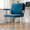 A blue office chair with a built-in cat bed, featuring a cat peeking out. The chair is placed near a window with sheer curtains and a desk with a laptop. Voir les images du produit