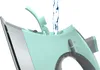 Water being poured into a steam iron. Produktbild-Vorschau
