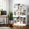 A white bookshelf filled with books and decorative items is placed next to a desk with a computer and a large potted plant. Náhľad obrázku produktu
