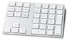 A close-up, top-down view of a silver and white extended wireless keypad. Náhled obrázku produktu