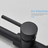 Close-up of a black kitchen faucet knob and handle. Náhled obrázku produktu