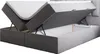 A grey upholstered boxspring bed with the mattress lifted to reveal storage space underneath. Produktbild-Vorschau