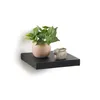 A black floating shelf with a potted plant and a small decorative bunny. Náhled obrázku produktu
