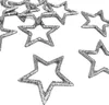 A collection of glittery star-shaped confetti scattered on a white background. Produktbild-Vorschau