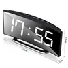 A digital alarm clock with a mirrored LED display and buttons on top, shown from a slight angle on a white background. Dimensions are indicated with lines and text. Produktbild-Vorschau