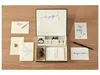 A calligraphy set laid out on a wooden surface. Produktbild-Vorschau
