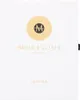 A white box with gold lettering and a gold circular logo. Anteprima dell’immagine prodotto