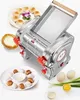 A close-up of a stainless steel pasta machine with various food items and ingredients arranged around it. Produktbild-Vorschau