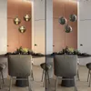 A split image showing a dining room with a pendant light fixture over a table. The left side shows the lights on with warm lighting, and the right side shows the lights off with cooler lighting. Produktbild-Vorschau