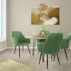 A dining room scene with a round table and four green chairs. Náhled obrázku produktu