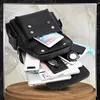 A black rucksack overflowing with various electronic devices and accessories, presented on a decorative background. Produktbild-Vorschau