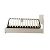 A beige upholstered bed frame with the wooden slats of the bed base extended upwards, showing the storage compartment underneath. Produktbild-Vorschau